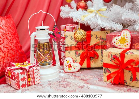 Christmas decorations. Happy New Year. Antique lantern, Christmas balls, gift boxes with ribbons. Christmas holiday. The new year's holiday