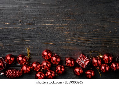 Christmas decorations and objects set, top view flat lay, on black wooden table background, with copy space for text