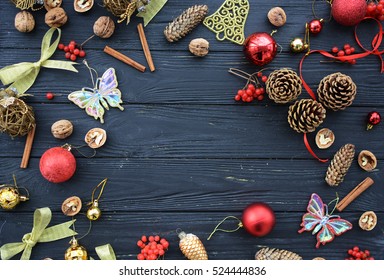 Christmas decorations on a black wooden background