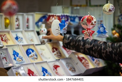 Christmas Decorations On Christmas Market In European City. Fair And Market Stalls With Craft Items. Winter Street Market In Europe.