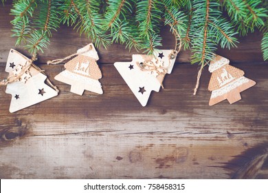 Christmas decorations on old dark boards. Christmas background. New Year background. Xmax background. Christmas tree. Toned image.