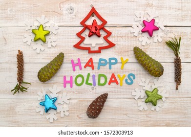 Christmas Decorations (Ornaments, Pine Cones, Snowflakes) Bottlebrush Seed Pods On Whitewashed Wood Background Table