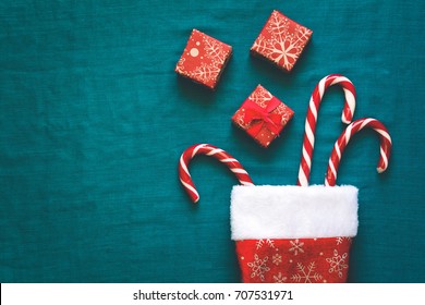 Christmas decorations (wooden toys, snowflakes, hat) on turquoise background. Top view. Flat lay - Powered by Shutterstock