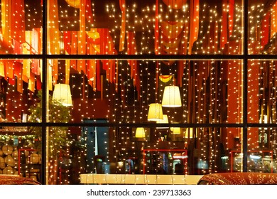 Christmas Decorative Lights Of Restaurant Window In Night