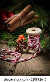Christmas decorative thread and cinnamon.  Selective focus, toned