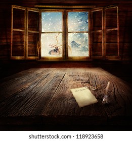 Christmas Design - Dear Santa. Xmas Winter Background In Wooden Cabin With Letter To Santa Clause, Reindeer And Winter Landscape In The Back.