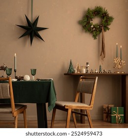 Christmas dining room interior with table, green tablecloth, wooden console, christmas wreath, chair, gifts, candle with candlestick, grown wall and elegant accessories. Home decor. Template. - Powered by Shutterstock