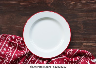 Christmas Dinner Background, Plate And Napkin On Dark Rustic Wooden Table, Top View