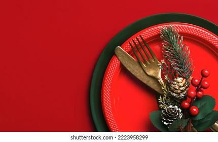 Christmas dinner concept. Vintage old cutlery and christmas ornament with space for text over a red background. Christmas concept background - Powered by Shutterstock