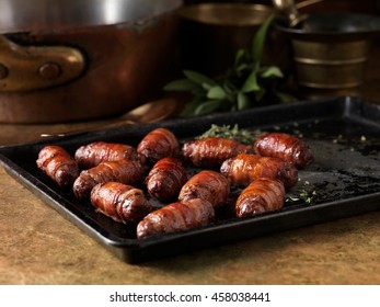 Christmas Dinner Snack. Festive Spiced Bacon And Venison Cocktail Sausage Rolls. Pigs In Blankets With Thyme Bay Leaves