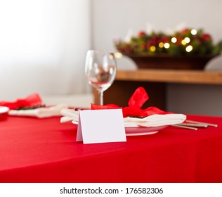 Christmas Dinner Table Setting With Name Card In Red 