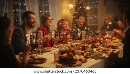Christmas Dinner Together with Parents, Children and Friends at Home. Multicultural Family Singing Jingle Bells, Celebrating a Holiday with a Delicious Turkey Meal in the Evening