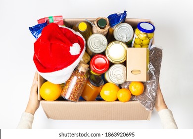 Christmas Donation. Food Donations Box With Grocery Products On White Background. Top View