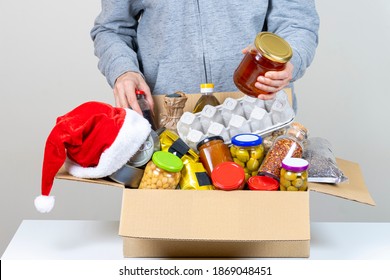 Christmas Donation. Volunteer Collect Food Donation Box With Grocery Products