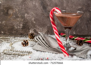 Christmas Drinks, Peppermint Mocha Martini Cocktail With Candy Cane, On Grey Background Copy Space 