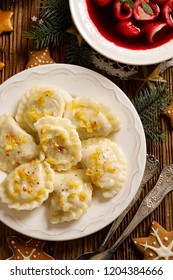 Christmas Dumplings Stuffed With Mushroom And Cabbage On A White Plate, Top View. Traditional Christmas Eve Dish In Poland