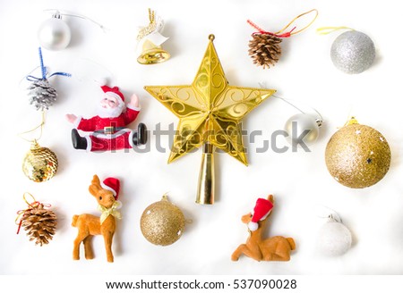 Christmas elements decoration such as toys as a santa, star, golden bell, ball, reindeer, pine cone top view.