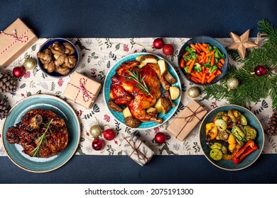 Christmas Evening Table Top View With Festive Food With Baked Turkey Or Chicken, Roasted Vegetables, Xmas Dinner With Assorted Delicious Meals, Wrapped Presents And Fir Tree Flat Lay 
