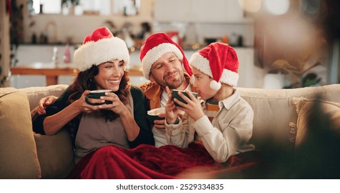 Christmas, family and happy on sofa with hot chocolate, coco and relax in home. Parents, child and eggnog in living room for comfort, warmth and enjoy festive season in winter with love and support - Powered by Shutterstock