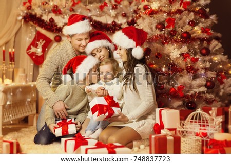 Christmas Family Portrait, Happy Father Mother Teenager Child and Baby,  Xmas Tree and Presents Gifts