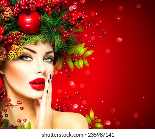 Christmas Fashion Model Woman. Xmas New Year Hairstyle And Make Up. Beauty Girl  Portrait. Gorgeous Vogue Style Lady With Christmas Decorations On Her Head, Baubles, Professional Makeup, Red Lipstick