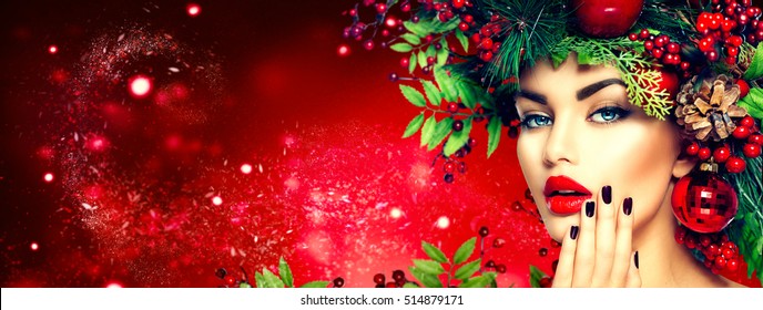 Christmas Fashion Model Woman. Xmas New Year Hairstyle And Make Up. Beauty Girl Portrait. Gorgeous Vogue Style Lady With Christmas Decorations On Her Head, Baubles, Professional Makeup, Red Lipstick