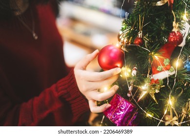 Christmas Festival Holiday Concept. Woman Hand Decorating Xmas Tree Prepare Celebration On December Festival At Home.