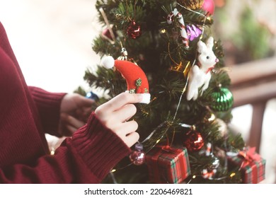 Christmas Festival Holiday Concept. Woman Hand Decorating Xmas Tree Prepare Celebration On December Festival At Home.