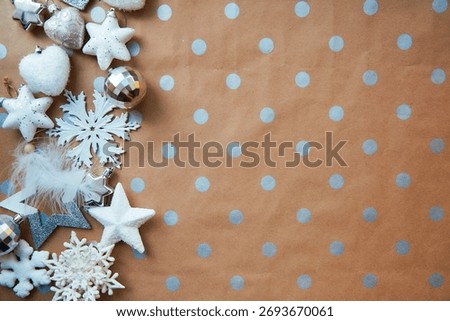 Christmas festive background - basic classic pattern, copy space. Silver and white trendy decorations: disco balls, fluffy Christmas tree toys. Merry Christmas atmosphere and home coziness concept