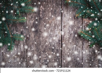 Christmas Fir branches on wooden background. Xmas and Happy New Year composition. Flat lay, top view. Copy space