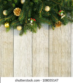 Christmas fir tree with decoration on a wooden board