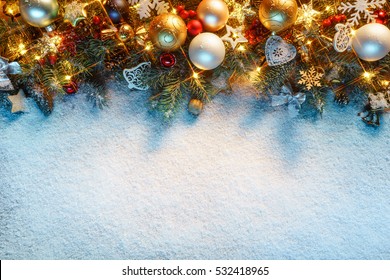 Christmas fir tree with decoration on snowy background. Merry Christmas and Happy New Year!! Top view.