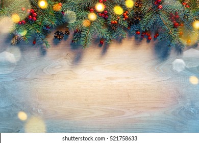 Christmas fir tree with lights on wooden background. Merry Christmas and Happy New Year!! Top view. 