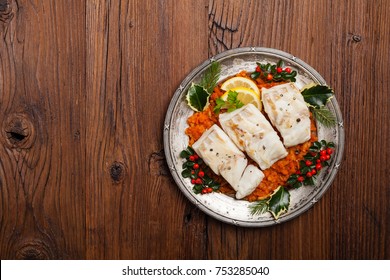 Christmas Fish. Roasted Cod Pieces, Served In Vegetable Sauce. Xmas Styling. Top View.