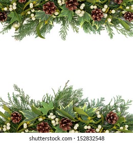 Christmas Floral Background Border With Mistletoe, Ivy, Pine Cones And Winter Greenery Over White.