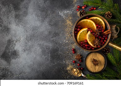 Christmas Food Background , Mulled Wine And Ingredients On Dark Grey Concrete Surface. Top View, Copy Space