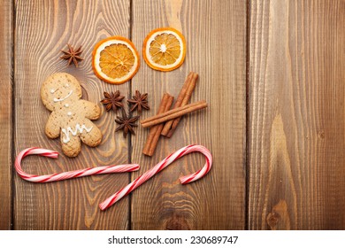 Christmas Food Decoration With Gingerbread Cookies, Spices And Candies. View From Above On Wooden Background With Copy Space