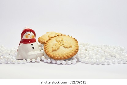 Christmas Food And Decoration With Snowman And Mince Pies On White Background For Festival Of Christmas And New Year. Holidays Season.