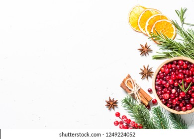 Christmas Food Drink Background. Ingredients For Cooking - Cranberry, Rosemary, Orange And  Anise On White Background. Top View Copy Space.