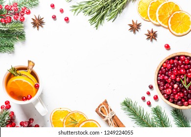 Christmas Food Drink Background. Winter Fruit Tea From Cranberry, Rosemary, Orange And  Anise On White Background. Top View Copy Space.