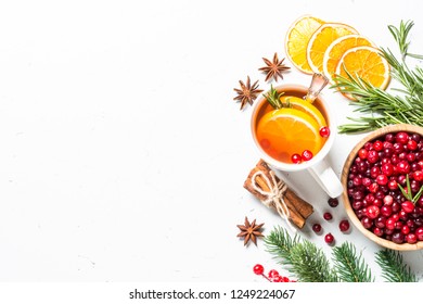 Christmas Food Drink Background. Winter Fruit Tea From Cranberry, Rosemary, Orange And  Anise On White Background. Top View Copy Space.