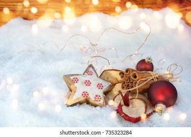 Christmas Fragrance With Apple Rings And Cinnamon Sticks In Snow 