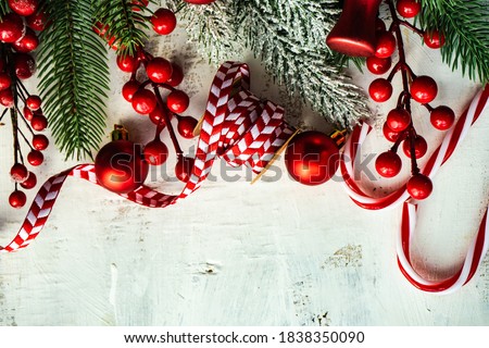 Christmas frame with xmas tree branches on white rustic wooden background
