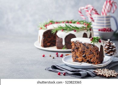Christmas fruit cake, pudding on white plate. Traditional New Year dessert. Copy space. 