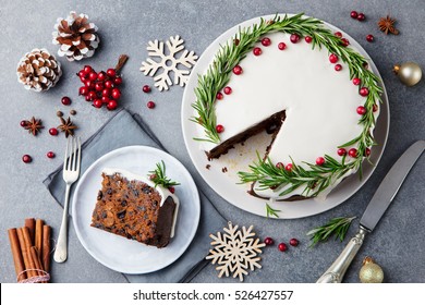 Christmas fruit cake, pudding on white plate. Copy space. Top view.
