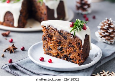 Christmas fruit cake, pudding on white plate. Close up. 