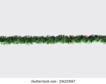 Christmas Garland Isolated On Grey Background. Top View Of Xmas Decoration Close-Up With Text Space