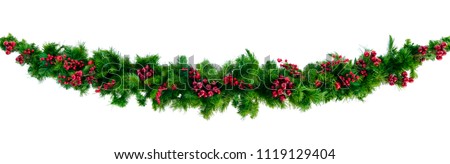 Christmas garland with red berries, isolated on white.