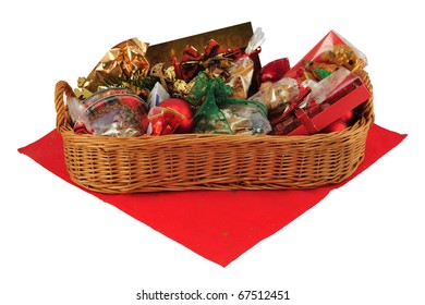 Christmas Gift Basket On Red Table Cloth Isolated On White.