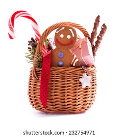 Christmas Gift Basket With Treats And Gingerbread Man Isolated On White